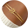 Turandoss Gold Knot Bangle Bracelets for Women - Dainty 18K Gold Plated Cuff Bangle Bracelets for Women Trendy Personalized Open Love Knot Bracelet Adjustable Cuff Bracelet Valentine Gifts for Her
