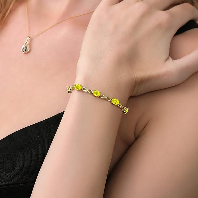 Gem Stone King 7X5MM Oval Cut Gemstone Birthstone and Accent Lab Grown Diamond Tennis Bracelet For Women In 18K Yellow Gold Plated Silver | Adjustable Bolo Bracelet For Women | Easy-On Easy-Off