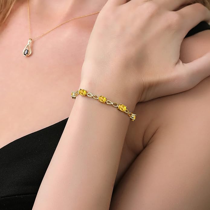 Gem Stone King 7X5MM Oval Cut Gemstone Birthstone and Accent Lab Grown Diamond Tennis Bracelet For Women In 18K Yellow Gold Plated Silver | Adjustable Bolo Bracelet For Women | Easy-On Easy-Off